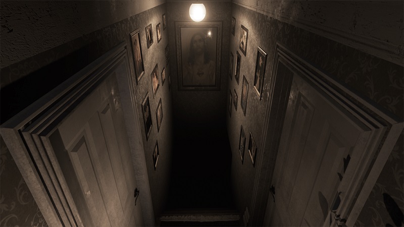 Screenshot from Visage which shows the top of a staircase leading down to a pitch black cellar.