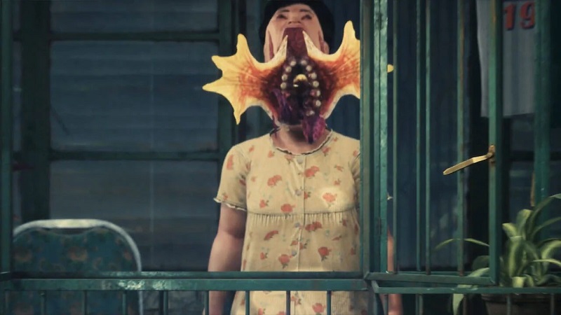 Screenshot from the Slitterhead trailer showing a woman's face opening up.