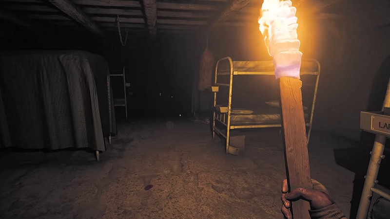 Amnesia: The Bunker - the player holding a flaming torch.