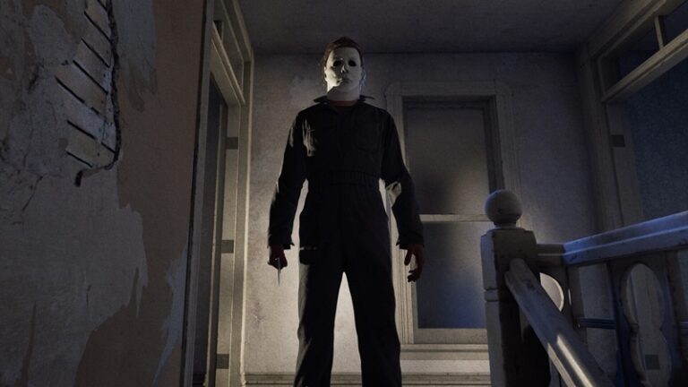 Halloween The Game: Michael Myers in his iconic white mask stands at the top of some stairs.