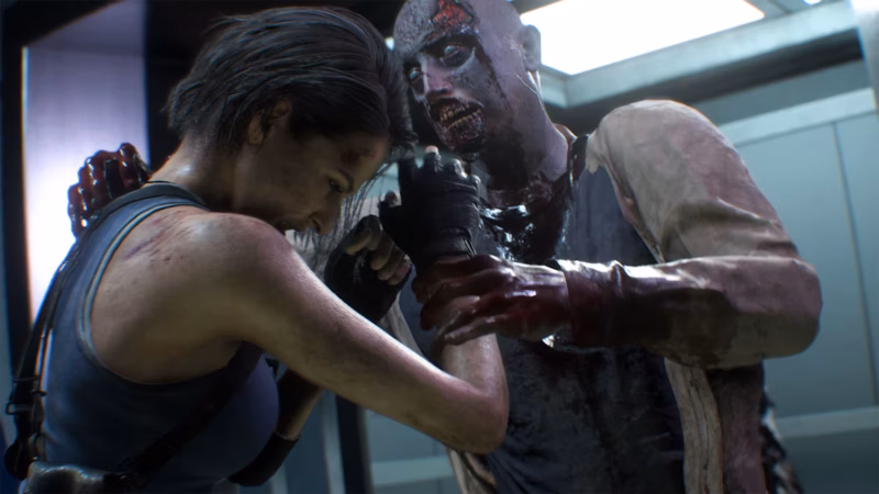 Resident Evil 3: Jill Valentine cowers as a zombie attacks her outside an elevator.