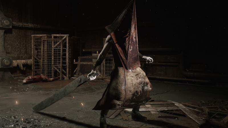 Silent Hill: a creature with a large metal pyramid-shaped head stands in a dark room holding a gigantic knife in one hand.