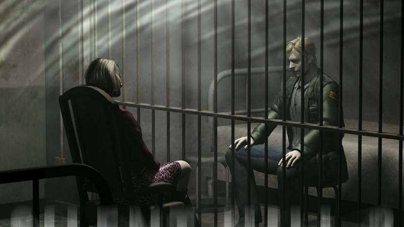 Silent Hill 2: Mary and James sit staring at each other from either side of a jail cell.