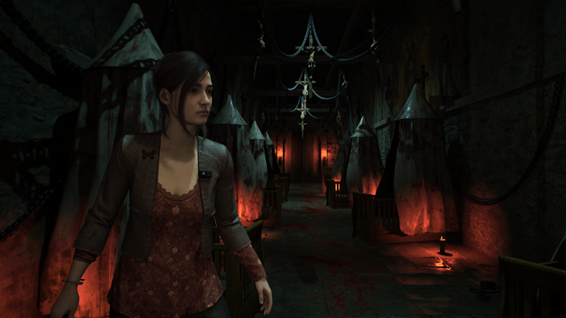 Remothered Red Nun's Legacy: a young woman walks down a dark and creepy corridor that's lit by small candles on the floor.
