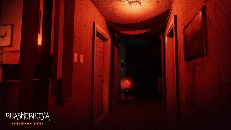 Phasmophobia: a screenshot showing a dark corridor of a home, bathed in a red, eerie glow.